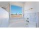 Bright bathroom features a soaking tub and a large window with neighborhood views at 529 Fork Mesa Ct, Henderson, NV 89015