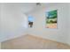 A bright bedroom with neutral carpet, and two windows letting in natural light at 529 Fork Mesa Ct, Henderson, NV 89015