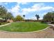 Grassy community park with mature trees, walking paths, landscaping, and a covered gazebo at 529 Fork Mesa Ct, Henderson, NV 89015