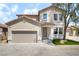 Charming stucco two-story home with a two car garage and a well kept yard at 529 Fork Mesa Ct, Henderson, NV 89015