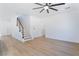 Bright and airy living room with wood floors and staircase at 529 Fork Mesa Ct, Henderson, NV 89015