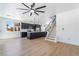 This spacious living room boasts an open floor plan, modern black kitchen, and staircase access at 529 Fork Mesa Ct, Henderson, NV 89015