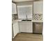 Updated kitchen featuring stainless steel dishwasher and bright countertops at 5512 Del Lago Dr, Las Vegas, NV 89130