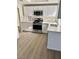 Modern kitchen with stainless steel appliances, ample counter space, and sleek cabinetry at 5512 Del Lago Dr, Las Vegas, NV 89130