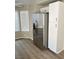 Bright kitchen with stainless steel refrigerator and ample storage space at 5512 Del Lago Dr, Las Vegas, NV 89130