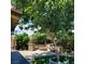 Picturesque backyard with a stone fire pit and seating area at 5516 Coyote Falls Ct, Las Vegas, NV 89131