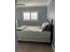 This is a bedroom with neutral carpet and plantation shutters at 5516 Coyote Falls Ct, Las Vegas, NV 89131