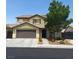 Charming two-story home featuring a neutral palette, well-kept lawn and convenient attached two-car garage at 5516 Coyote Falls Ct, Las Vegas, NV 89131