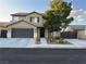 Charming two-story home with a well-maintained yard and a two-car garage at 5516 Coyote Falls Ct, Las Vegas, NV 89131