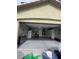 Spacious garage with epoxy flooring, built-in storage, and utility sink, offering ample space for vehicles and projects at 5516 Coyote Falls Ct, Las Vegas, NV 89131
