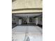 Well-lit garage featuring epoxy flooring, a utility sink, and organized storage, blending functionality with a clean design at 5516 Coyote Falls Ct, Las Vegas, NV 89131