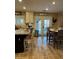Eat-in kitchen features granite counters, a center island, and tile floors, providing style and functionality at 5516 Coyote Falls Ct, Las Vegas, NV 89131