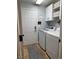 Convenient laundry room with overhead storage and plenty of space at 5516 Coyote Falls Ct, Las Vegas, NV 89131