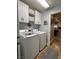 Convenient laundry room with cabinets and plenty of space at 5516 Coyote Falls Ct, Las Vegas, NV 89131