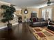 Spacious living room with hardwood floors, stylish decor, and plantation shutters at 5516 Coyote Falls Ct, Las Vegas, NV 89131