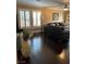 This living room has dark hardwood floors and plantation shutters for privacy at 5516 Coyote Falls Ct, Las Vegas, NV 89131