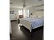Comfortable main bedroom with a decorative ceiling fan and plantation shutters for adjustable light at 5516 Coyote Falls Ct, Las Vegas, NV 89131