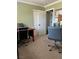This is an office with neutral carpet and light green walls at 5516 Coyote Falls Ct, Las Vegas, NV 89131