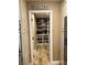 View into a well-stocked pantry with white shelving and butcher block counters at 5516 Coyote Falls Ct, Las Vegas, NV 89131