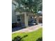 Covered patio with an outdoor kitchen area and comfortable seating arrangement at 5516 Coyote Falls Ct, Las Vegas, NV 89131