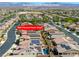 Aerial view of a residential neighborhood showing houses with solar panels, pools, landscaping, and nearby VA Southern Nevada Healthcare System at 5650 Pleasant Palms St, North Las Vegas, NV 89081
