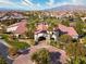 Community clubhouse with lush landscaping, tennis courts, and stunning mountain views at 5650 Pleasant Palms St, North Las Vegas, NV 89081