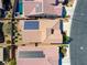 An aerial view highlighting homes with solar panels, landscaped yards, and backyard layouts within a residential area at 5650 Pleasant Palms St, North Las Vegas, NV 89081