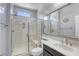 Modern bathroom features a glass enclosed shower and beautiful fixtures at 5650 Pleasant Palms St, North Las Vegas, NV 89081