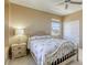 Comfortable bedroom with neutral walls, plenty of natural light, and ceiling fan at 5650 Pleasant Palms St, North Las Vegas, NV 89081