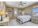 Comfortable bedroom with neutral walls, plenty of natural light, and tasteful decor at 5650 Pleasant Palms St, North Las Vegas, NV 89081