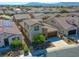 Charming two-story home featuring a stone facade, tile roof, and a well-maintained front yard in a sunny neighborhood at 5650 Pleasant Palms St, North Las Vegas, NV 89081