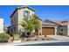 Attractive two-story home with desert landscaping, a brick facade, and a two-car garage at 5650 Pleasant Palms St, North Las Vegas, NV 89081
