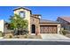 Beautiful two-story home with brick accents, a two-car garage, and low-maintenance desert landscaping at 5650 Pleasant Palms St, North Las Vegas, NV 89081