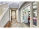 Inviting foyer with herringbone floors, staircase, and an open view to the dining room at 5650 Pleasant Palms St, North Las Vegas, NV 89081