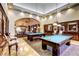 Upscale game room featuring pool tables, comfortable seating, and elegant lighting at 5650 Pleasant Palms St, North Las Vegas, NV 89081