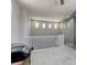 Bright hallway featuring neutral walls, carpet flooring, a white railing, and natural light from multiple windows at 5650 Pleasant Palms St, North Las Vegas, NV 89081