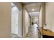 Elegant hallway with arched entryways, decorative flooring, and a view into the living room at 5650 Pleasant Palms St, North Las Vegas, NV 89081