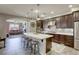 Open concept kitchen includes island, breakfast bar and stainless appliances at 5650 Pleasant Palms St, North Las Vegas, NV 89081
