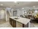 Open kitchen with island offers seamless flow to the living room at 5650 Pleasant Palms St, North Las Vegas, NV 89081