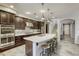 Gourmet kitchen features sleek cabinetry, stainless steel appliances and center island at 5650 Pleasant Palms St, North Las Vegas, NV 89081