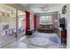 Bright living room extends to a covered patio with fireplace, perfect for indoor-outdoor living at 5650 Pleasant Palms St, North Las Vegas, NV 89081
