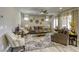 Inviting living room with stylish furnishings, a ceiling fan, and decorative accents at 5650 Pleasant Palms St, North Las Vegas, NV 89081