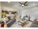Open-concept living room connects to kitchen, featuring modern finishes and comfortable seating at 5650 Pleasant Palms St, North Las Vegas, NV 89081