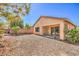 Backyard with a covered patio and minimal landscaping at 5960 Wheat Penny Ave, Las Vegas, NV 89122