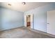 Bedroom with carpet, features ensuite bathroom, and bright blue walls at 5960 Wheat Penny Ave, Las Vegas, NV 89122
