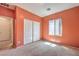 Carpeted bedroom featuring a window and closet for ample storage space at 5960 Wheat Penny Ave, Las Vegas, NV 89122