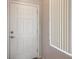 Bright entryway featuring a traditional door and window offering natural light at 5960 Wheat Penny Ave, Las Vegas, NV 89122