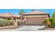 Charming home with a two-car garage, desert landscaping, and a private gated courtyard at 5960 Wheat Penny Ave, Las Vegas, NV 89122