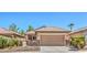 Charming single-story home featuring a two-car garage, desert landscaping, and a gated front porch at 5960 Wheat Penny Ave, Las Vegas, NV 89122