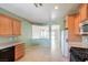 A light, bright kitchen features light-colored cabinets and tile flooring at 5960 Wheat Penny Ave, Las Vegas, NV 89122